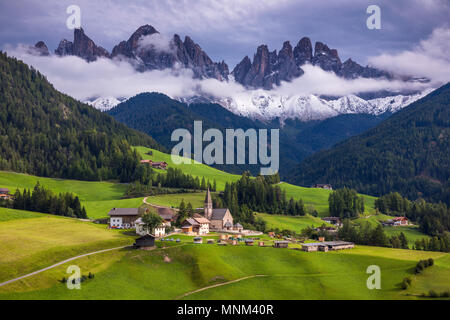 Famous best alpine place of the world, Santa Maddalena (St Magdalena) village with magical Dolomites mountains in background, Val di Funes valley, Tre Stock Photo