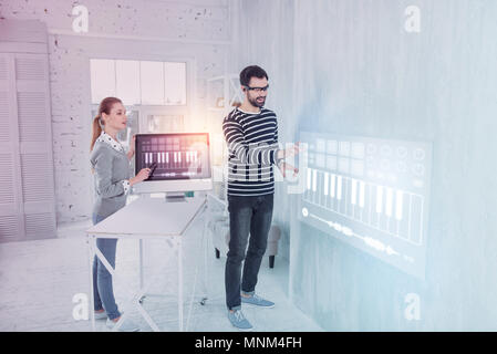Creative programmers feeling impressed while working Stock Photo