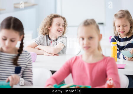 Happy children having lunch together in primary school canteen Stock Photo  - Alamy