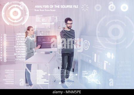 Smart programmers using virtual reality while working Stock Photo