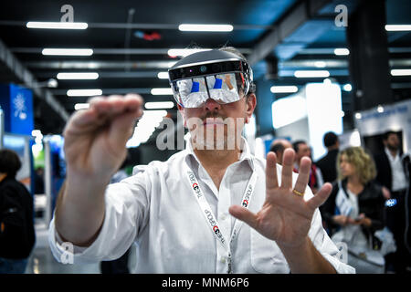 Milan, Italy - 17 May 2018: a man wearing a VR Virtual Reality headset gesticulates during the Technology Hub 2018. Stock Photo