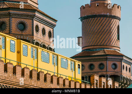 Close-up of yellow train passing over Oberbaum Bridge Stock Photo