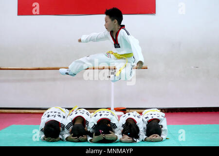 Beijing, China. 17th May, 2018. Children attend a Taekwondo class at China National Children's Center in Beijing, capital of China, May 17, 2018. Credit: Zhang Yuwei/Xinhua/Alamy Live News Stock Photo