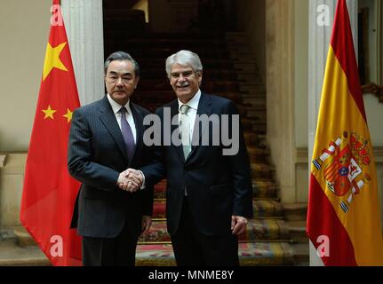 Madrid, Spain. 17th May, 2018. Chinese State Councilor and Foreign Minister Wang Yi (L) shakes hands with Spanish Foreign Affairs and Cooperation Minister Alfonso Dastis before meeting in Madrid, Spain, May 17, 2018. Credit: Guo Qiuda/Xinhua/Alamy Live News Stock Photo