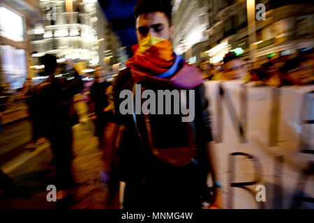Madrid, Spain. 17th May, 2018. Protester on the Gran Via of Madrid with his face hooded.Hundreds of demonstrators took to the streets of Madrid to demand LGBT and gay rights. Credit: Mario Roldan/SOPA Images/ZUMA Wire/Alamy Live News Stock Photo