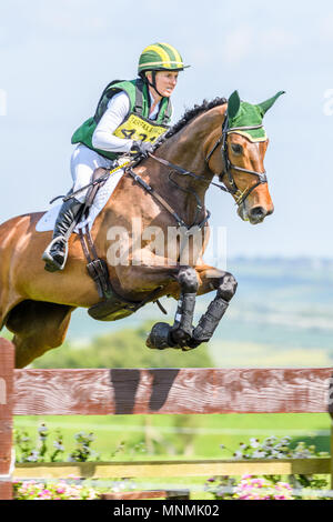 Corby, England. 18th May 2018. The horse Cierra and rider Christina Henriksen leap an obstacle fence in the cross country event during the international horse trials at the park of Rockingham Castle, Corby, England on 18 May 2018. Credit: Michael Foley/Alamy Live News Stock Photo