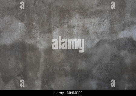 Abstract grunge background with gray wall with the water splashes and wet stains. Stock Photo