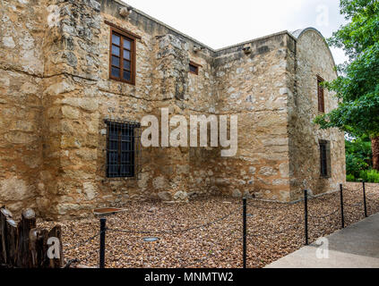 The side wall of the Alamo, showing a barred window and cracked walls. Stock Photo