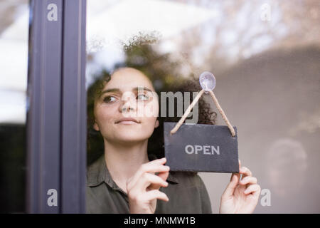Small business owner opening store Stock Photo