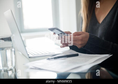 Young woman using smart phone Stock Photo