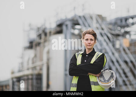Portrait of female industrial worker on site Stock Photo