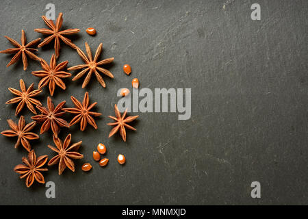 star anise on slate chopping board - closeup Stock Photo