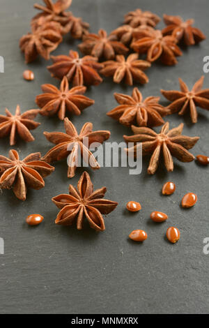 star anise on slate chopping board - closeup Stock Photo