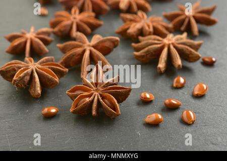 star anise on slate chopping board - closeup Stock Photo