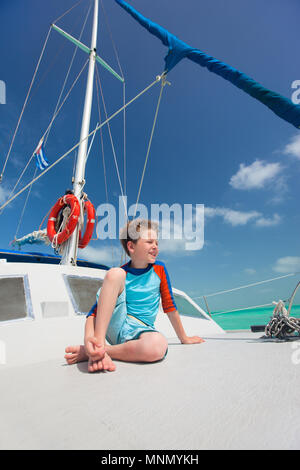 Little boy enjoying ride on a luxury yacht Stock Photo