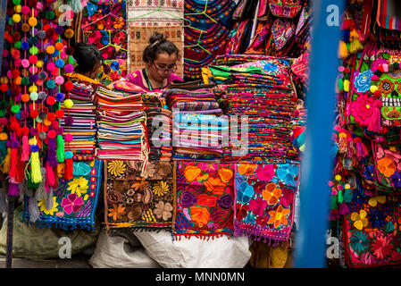 Stall with colourful Mexican fabrics, San Angel Art and Craft Saturday Market, Plaza San Jacinto, San Angel, Mexico City, Mexico