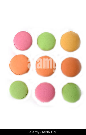 Top view. Three rows of multicolored macaroons. Isolated on whte background Stock Photo