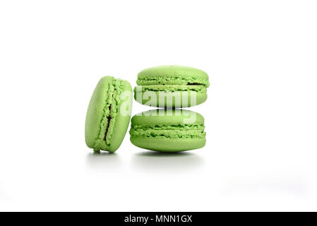 Three green macaroons isolated on white background Stock Photo