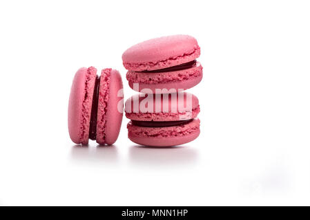 Three pink macaroons isolated on white background Stock Photo