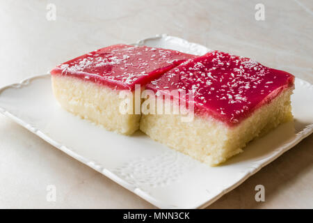 Turkish Muhallebi Semolina Dessert Pudding with Jelly Raspberry and Coconut Powder / Trilece. Traditional Dessert. Stock Photo