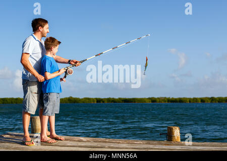 Dad and Son Go Fishing Together, Stand in the Water with Fishing