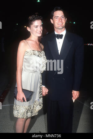 PASADENA, CA - SEPTEMBER 16: (L-R) Actress Lara Flynn Boyle and actor Kyle MacLachlan attend the 42nd Annual Primetime Emmy Awards on September 16,1990 at the Pasadena Civic Auditorium in Pasadena, California. Photo by Barry King/Alamy Stock Photo Stock Photo