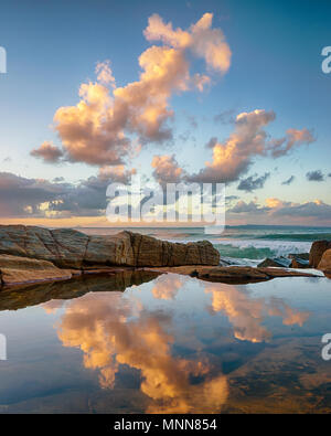 Sunset reflections in rock pools at Tea Tree Bay, Noosa National Park, Noosa Heads, Sunshine Coast, Queensland, Australia Stock Photo