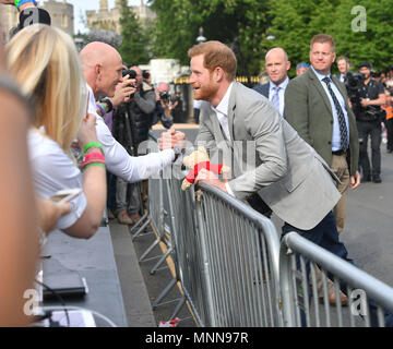 RETRANSMISSION adding names. Prince Harry speaks with Dean Stott, 41, from Aberdeen during a walkabout in Windsor as he met members of the public ahead of his wedding to Meghan Markle this weekend. Stock Photo