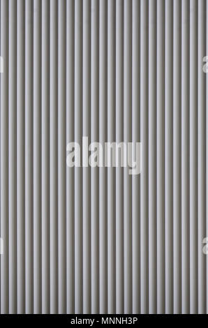 The texture of corrugated metal sheet, white or grey slide door. Old roller shutter texture for background Stock Photo