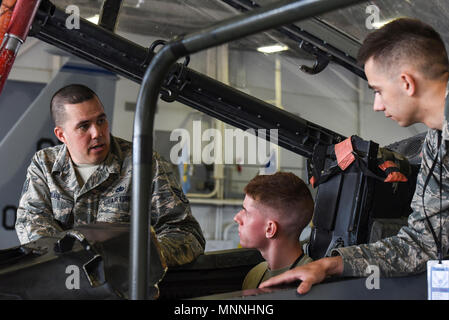 Staff Sgt. Eric Lindahl, a 364th Training Squadron aircraft electrical-environmental instructor, talks to his students at Sheppard Air Force Base, Texas, March 15, 2018. Lindahl, who just became an instructor the same day, talks to the E-E apprentices about the oxygen regulator in the cockpit. The regulator is connected to a green tank that is located directly below the pilot inside the aircraft's nose. Lindahl also teaches the apprentices of how to replace these regulators. Stock Photo