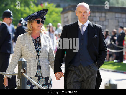 Sir Clive Woodward and Jayne Williams arrive at St George's Chapel at Windsor Castle for the wedding of Meghan Markle and Prince Harry. Stock Photo