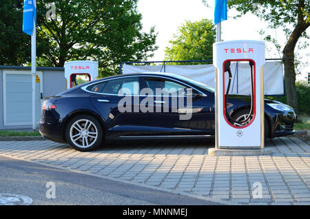Ellwangen, Germany - May 10, 2018: Tesla Model S charging at Supercharger Station in Ellwangen. Stock Photo