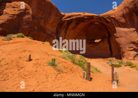 Eye of the eagle Big Hogan. Pothole natural arch eroded in sandstone. Navajo Tribal Park of Monument Valley, Arizona, Utah, USA Stock Photo