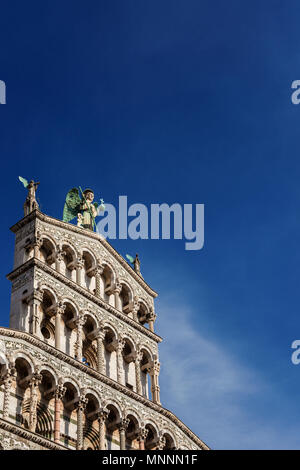 Saint Micheal in Foro Church beautiful medieval romanesque facade in the city of Lucca, Tuscany, erected in the 13th century (with blue sky and copy s Stock Photo
