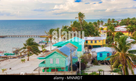 Caye Caulker, Belize - December 24, 2016: Aerial view at wooden pier dock  and picturesque, relaxing ocean view at Caye Caulker Belize Caribbean. Stock Photo