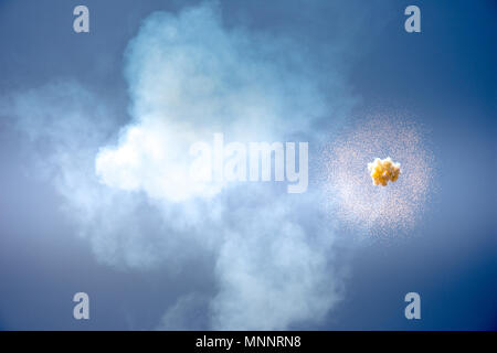 Abstract firework explosion with blue sky at the background. Stock Photo