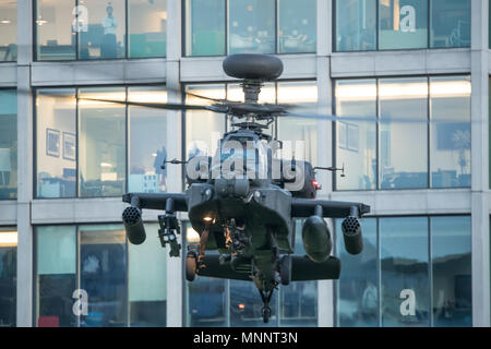 Army Air Corps WAH-64D  Apache Longbow departs from Finsbury Barracks in the heart of London at dusk. Stock Photo