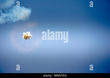 Abstract firework explosion with blue sky at the background. Stock Photo