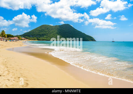 Reduit Beach - Tropical coast on the Caribbean island of St. Lucia. It is a paradise destination with a white sand beach and turquoiuse sea. Stock Photo