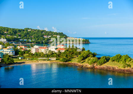 Tropical coast on the Caribbean island of St. Lucia. It is a paradise destination with a white sand beach and turquoiuse sea. Stock Photo