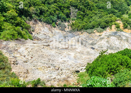 View of Drive-In Volcano Sulphur Springs on the Caribbean island of St. Lucia. La Soufriere Volcano is the only drive-in volcano in the world. Stock Photo