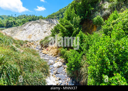 View of Drive-In Volcano Sulphur Springs on the Caribbean island of St. Lucia. La Soufriere Volcano is the only drive-in volcano in the world. Stock Photo