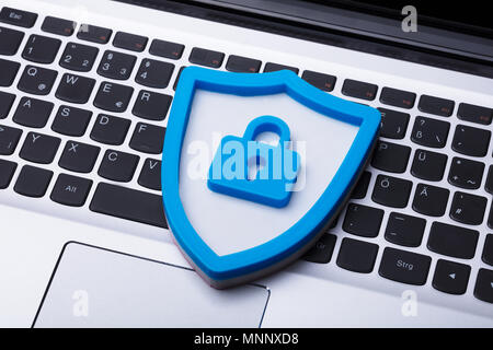High Angle View Of A Blue Shield Security Sign On Laptop Keypad Stock Photo