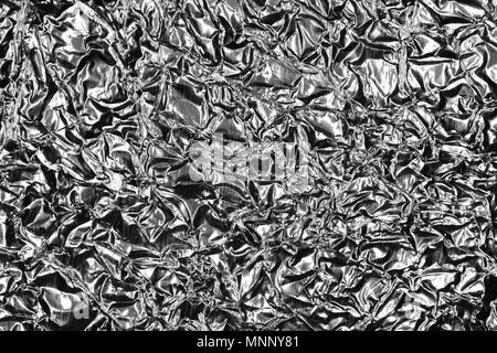 Monochrome Metallic Crumpled Foil Texture. Black & White Background. Stock Photo