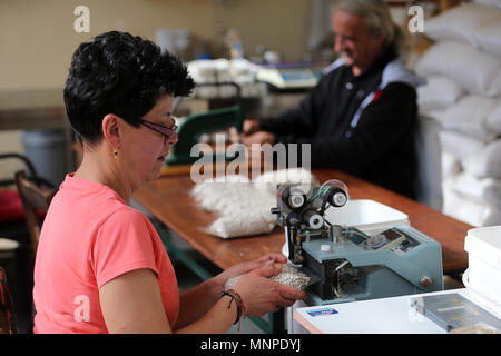 (180519) -- CORINTH, May 19, 2018 (Xinhua) --  Anna Dari (L) packs 'Feneos', at her local shop in the settlement of Gkoura in Corinth, some about 70 Km west of Athens, Greece, on May 16, 2018. In the highlands of Corinth prefecture at the Peloponnese peninsula, just two hours from Athens, local agricultural small businesses turn to extroversion to survive the economic crisis. To go with Feature: Greek agricultural community more extrovert in seeking business opportunities. (Xinhua/Marios Lolos) (dtf) Stock Photo