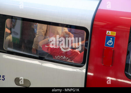 London, UK. 19th May 2018. Man U Fan on the London Tube Credit: Alex Cavendish/Alamy Live News Stock Photo