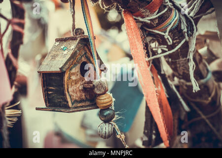 closeup photo of a tiny decorative house in the garden Stock Photo