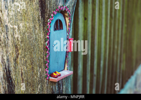 closeup photo of a tiny decorative house in the garden Stock Photo