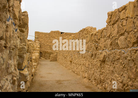 Some of the reconstructed ruins of the ancient Jewish clifftop fortress of Masada in Southern Israel.  This was the scene of an historic mass suicide. Stock Photo