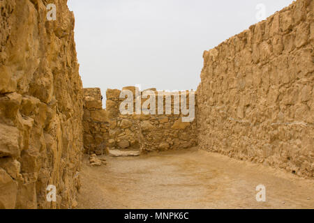 Some of the reconstructed ruins of the ancient Jewish clifftop fortress of Masada in Southern Israel.  This was the scene of an historic mass suicide. Stock Photo